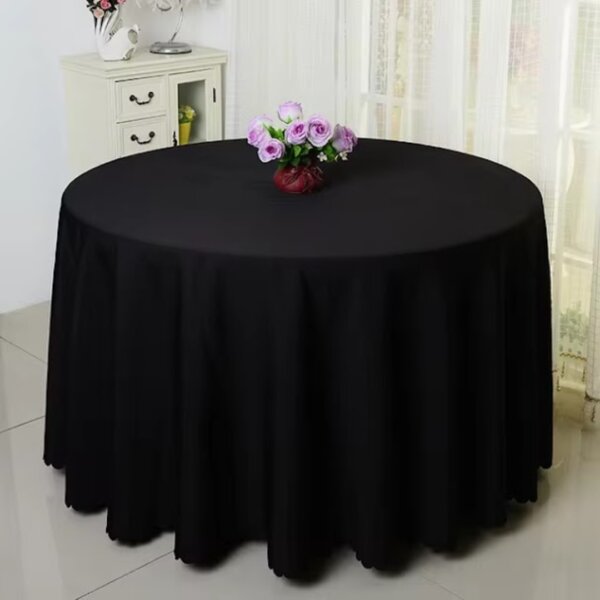 Black round tablecloth with jagged edge
